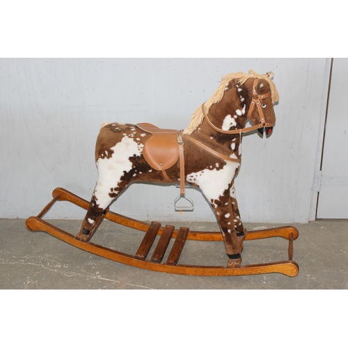 1562 - Child's stuffed rocking horse on wooden base, approx 144cm W x 104cm H x 38cm D