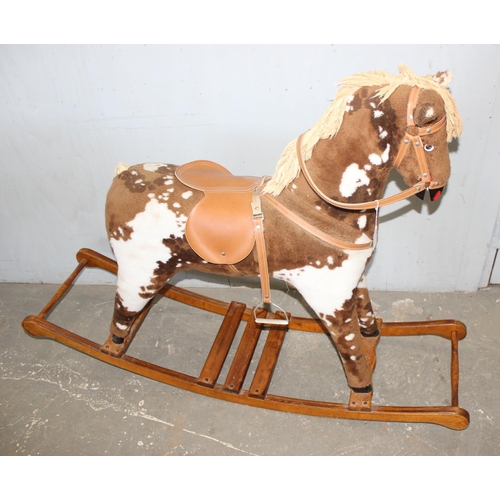 1562 - Child's stuffed rocking horse on wooden base, approx 144cm W x 104cm H x 38cm D