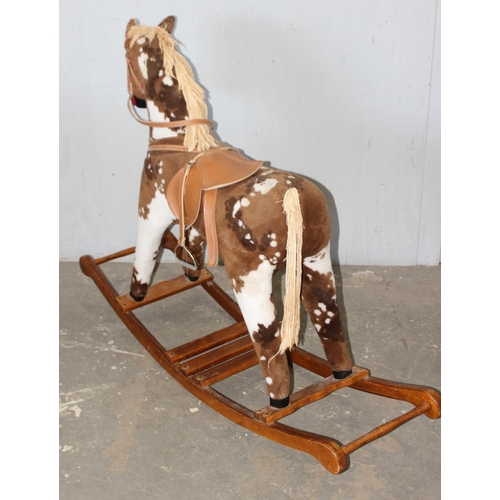 1562 - Child's stuffed rocking horse on wooden base, approx 144cm W x 104cm H x 38cm D