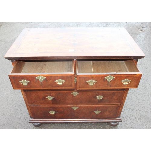 1 - A late 17th or early 18th century 2 over 3 chest of drawers with bun feet and later Georgian brass h... 