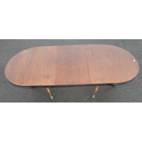 121 - An antique style mahogany twin pedestal dining table, approx 244cm wide x 103cm deep x 77cm tall