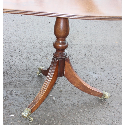 121 - An antique style mahogany twin pedestal dining table, approx 244cm wide x 103cm deep x 77cm tall