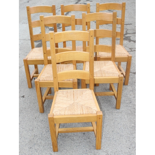 136 - Large light oak dining or refectory table with 2 drawers and 2 extending leaves and a set of 6 light... 