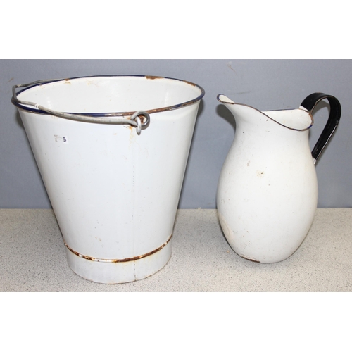 1824 - 2 pieces of enamelware to include a pale bucket and a large jug, largest piece approx. 30cm H x 30cm... 