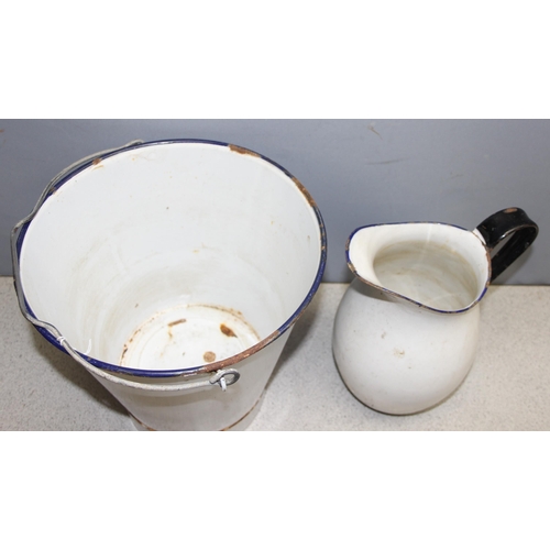 1824 - 2 pieces of enamelware to include a pale bucket and a large jug, largest piece approx. 30cm H x 30cm... 