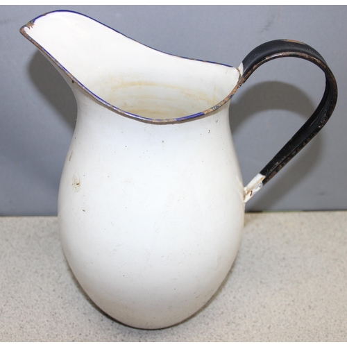 1824 - 2 pieces of enamelware to include a pale bucket and a large jug, largest piece approx. 30cm H x 30cm... 