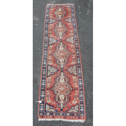 211 - A long vintage hall runner rug of red ground, probably Turkish, approx 95cm wide x 370cm long