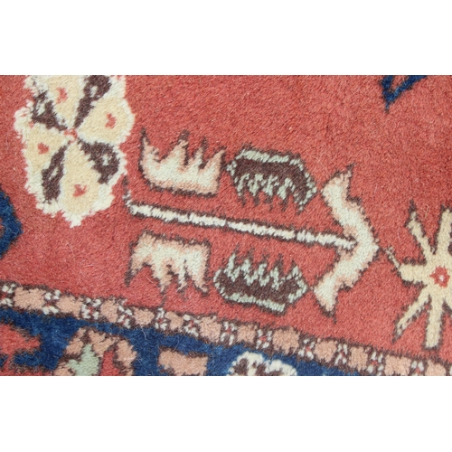 211 - A long vintage hall runner rug of red ground, probably Turkish, approx 95cm wide x 370cm long