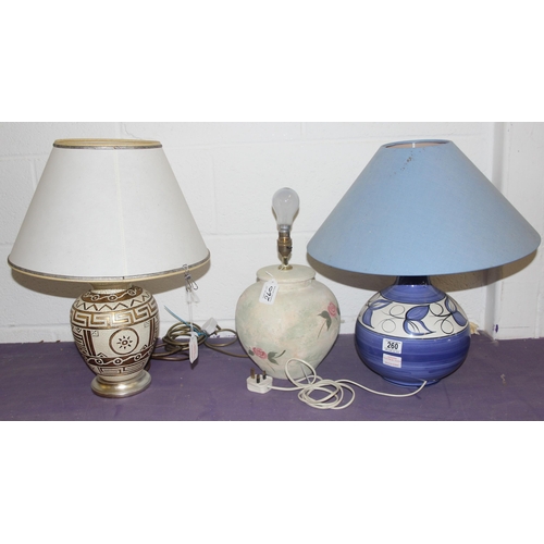 260 - 3 pottery lamps, one with gilt Grecian design, one with floral decoration and a blue glazed pottery ... 