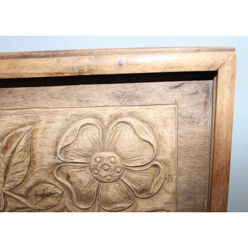 299C - An early 20th century Arts & Crafts period carved mahogany serving tray decorated with floral motifs... 