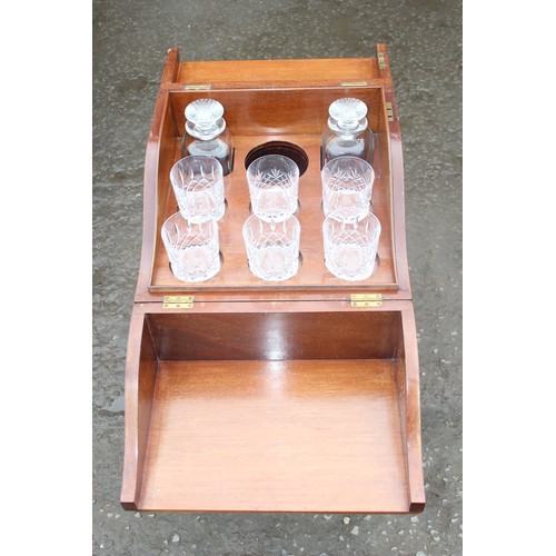 125 - A 19th century mahogany decanter box or tantalus on legs with 2 square decanters and 6 assorted scot... 