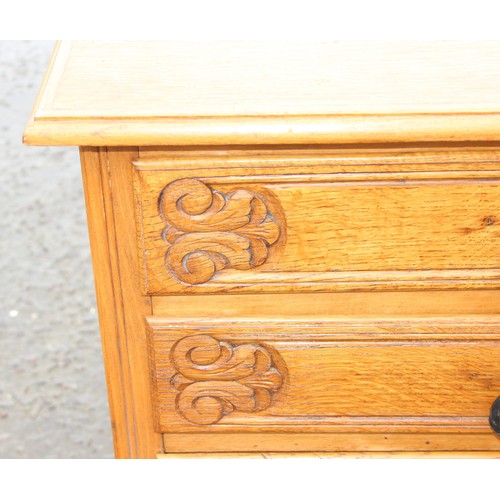 167 - An unusual vintage light oak 3 drawer chest of drawers with carved details, cabriole legs and iron h... 