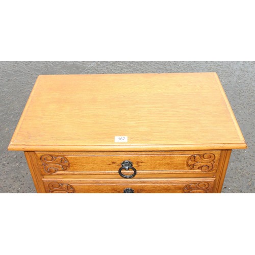 167 - An unusual vintage light oak 3 drawer chest of drawers with carved details, cabriole legs and iron h... 