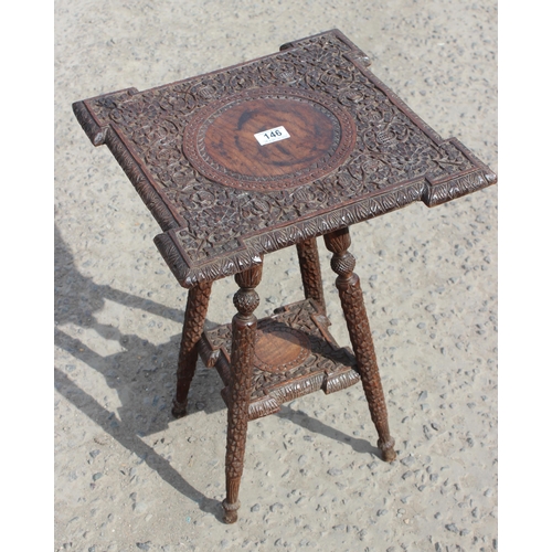 146 - An early 20th century Indian carved hardwood side table with undertier, approx 39cm wide x 39cm deep... 