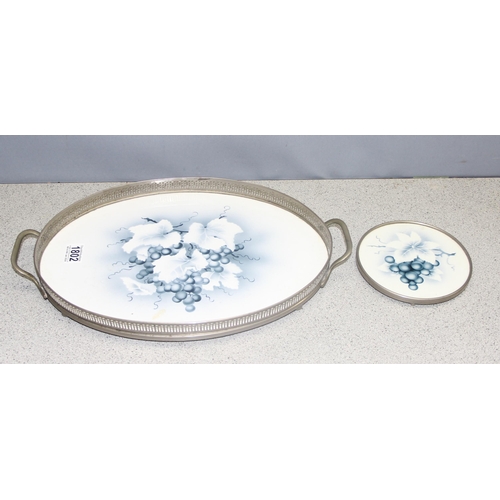 1802 - A secessionist Art Nouveau period blue and white ceramic tray depicting grape motif, with metal gall... 