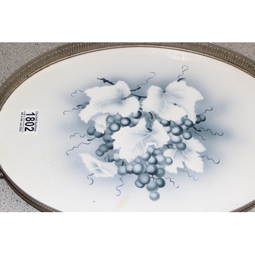 1802 - A secessionist Art Nouveau period blue and white ceramic tray depicting grape motif, with metal gall... 