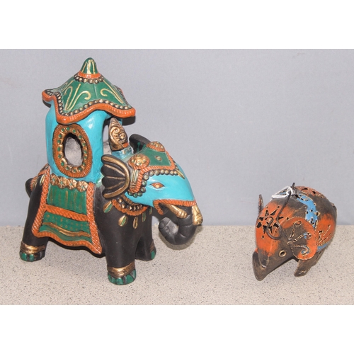 1803 - Ceramic model of an Indian elephant, approx 27cm tall, and a small metal elephant hanging tealight c... 