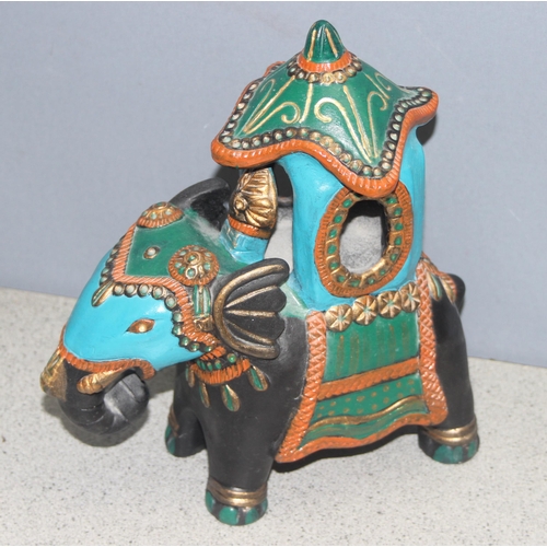 1803 - Ceramic model of an Indian elephant, approx 27cm tall, and a small metal elephant hanging tealight c... 