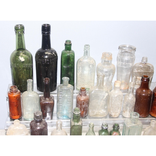 1805 - Qty of antique and later glass bottles in small metal trunk