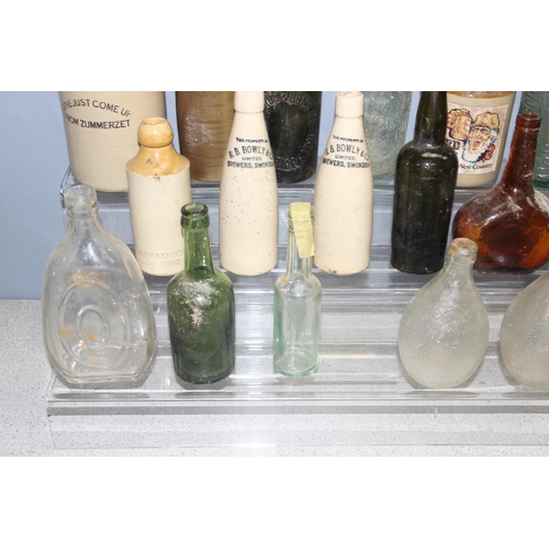 1807 - Qty of antique and later glass bottles incl Monsters, Newbury Brewery, and stoneware bottle, some ad... 