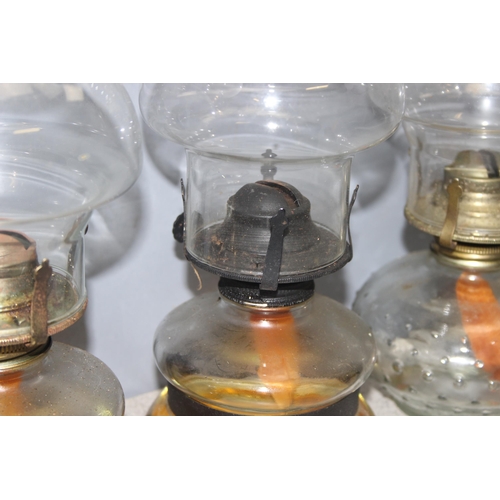 265 - 5 vintage oil lamps, some with glass shades, tallest approx 57cm