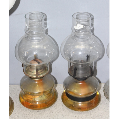 265 - 5 vintage oil lamps, some with glass shades, tallest approx 57cm