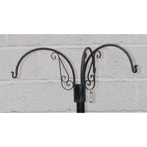 390 - A large free standing wrought iron hanging basket hanger, approx 91cm wide x 91cm deep x 177cm tall