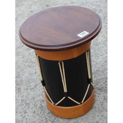 143 - A small side table formed as a drum and a leather topped magazine rack table (2)