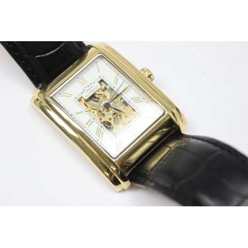 1318 - A vintage Rotary skeleton watch with automatic movement, gold plated case and black leather strap, m... 