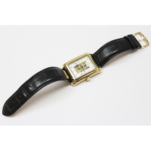 1318 - A vintage Rotary skeleton watch with automatic movement, gold plated case and black leather strap, m... 