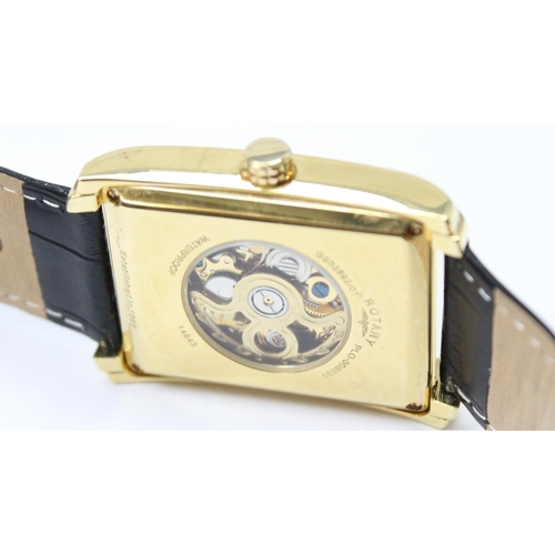 1318 - A vintage Rotary skeleton watch with automatic movement, gold plated case and black leather strap, m... 