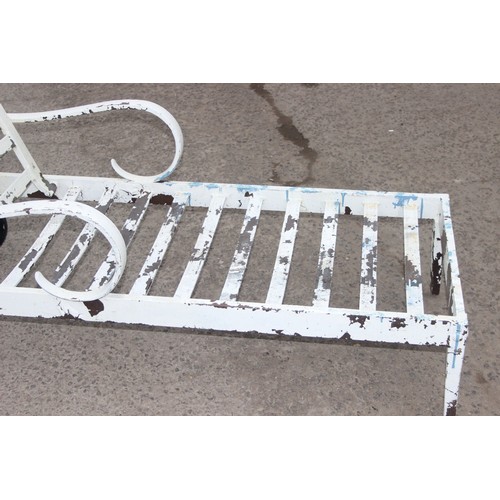 306 - A vintage white painted aluminium garden lounger, approx 168cm wide x 75cm deep x 110cm tall