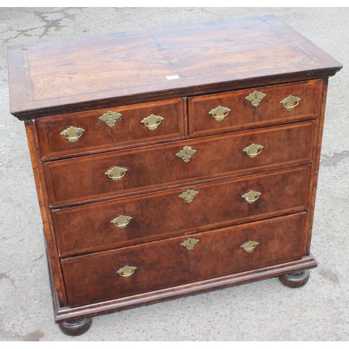 1 - A late 17th or early 18th century 2 over 3 chest of drawers with bun feet and later Georgian brass h... 