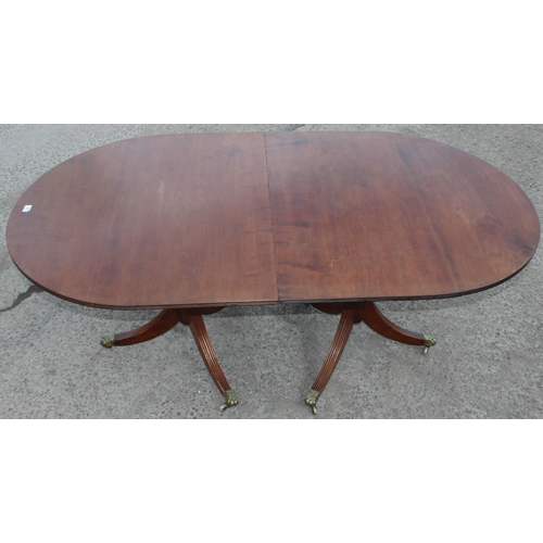 121 - An antique style mahogany twin pedestal dining table, approx 244cm wide x 103cm deep x 77cm tall