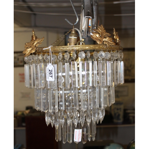 267 - A vintage crystal drop chandelier with brass mounts, approx 32cm in diameter