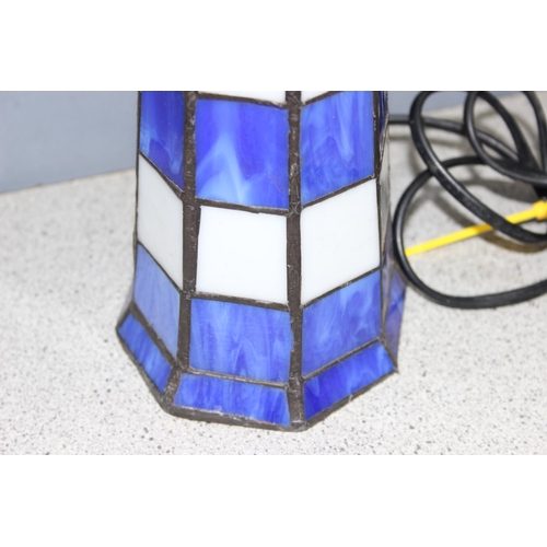 235 - Tiffany style lighthouse lamp in blue and white leaded glass, approx 29cm