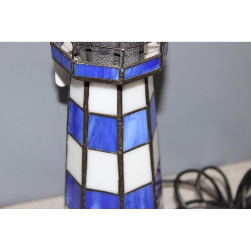 235 - Tiffany style lighthouse lamp in blue and white leaded glass, approx 29cm