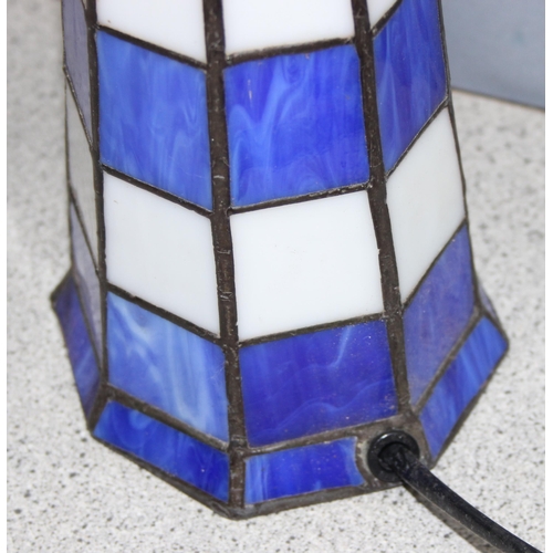 235 - Tiffany style lighthouse lamp in blue and white leaded glass, approx 29cm