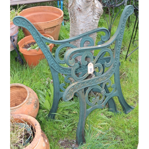 363 - A pair of green painted cast iron bench ends, approx 68cm wide x 79cm tall