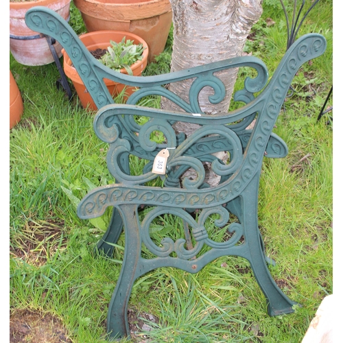 363 - A pair of green painted cast iron bench ends, approx 68cm wide x 79cm tall