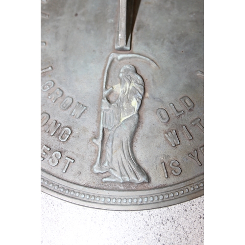 397 - Metal garden sundial with quote 'Grow Old Along With Me, The Best Is Yet To Come', approx 25cm diam