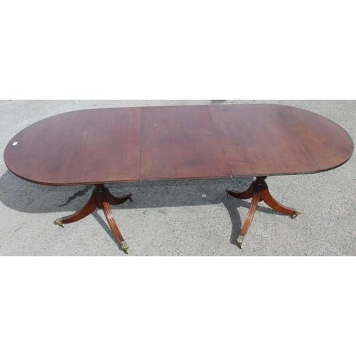 20 - An antique style mahogany twin pedestal dining table, approx 244cm wide x 103cm deep x 77cm tall