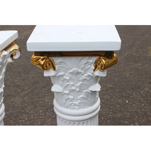 11 - A matched pair of white and gilt pottery Corinthian column plinths, possibly Italian but unmarked, t... 