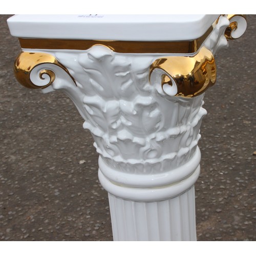 11 - A matched pair of white and gilt pottery Corinthian column plinths, possibly Italian but unmarked, t... 