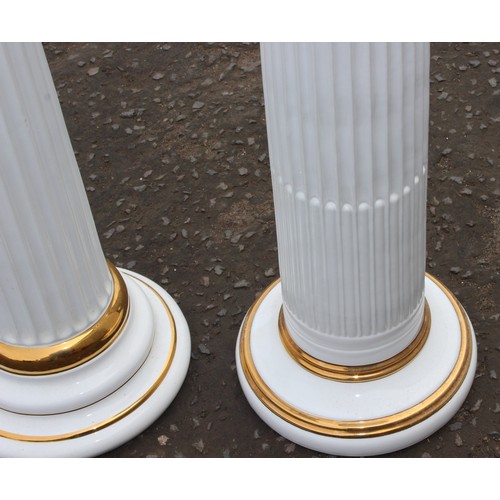 11 - A matched pair of white and gilt pottery Corinthian column plinths, possibly Italian but unmarked, t... 