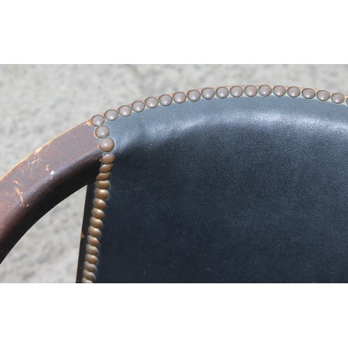 17 - A vintage oak and studded faux leather desk chair, approx 51cm wide x 51cm deep x 73cm tall