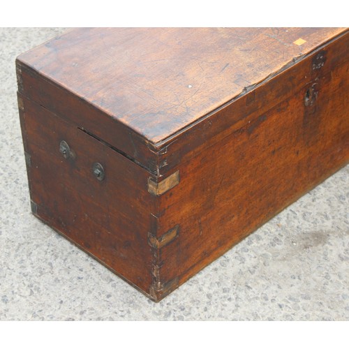 19 - A 19th century mahogany trunk with brass bound corners, approx 89cm wide x 40cm deep x 41cm tall