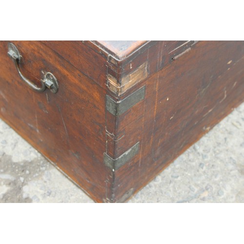 19 - A 19th century mahogany trunk with brass bound corners, approx 89cm wide x 40cm deep x 41cm tall