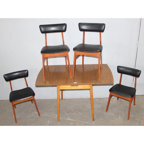 22 - A retro extending dining table and 4 retro black vinyl covered chairs, the table approx 68cm wide (e... 