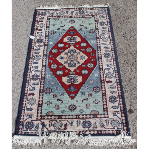 204 - Persian style blue-ground rug, approx 150cm x 80cm